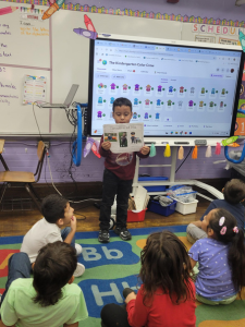boy holding a sheet of paper